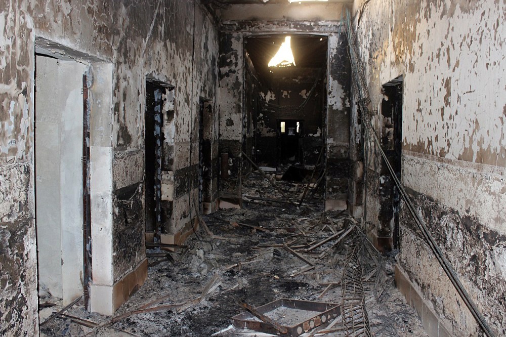 In this Friday, Oct. 16, 2015 photo, the charred remains of the Doctors Without Borders hospital is seen after being hit by a U.S. airstrike in Kunduz, Afghanistan. (Photo by Najim Rahim/AP)