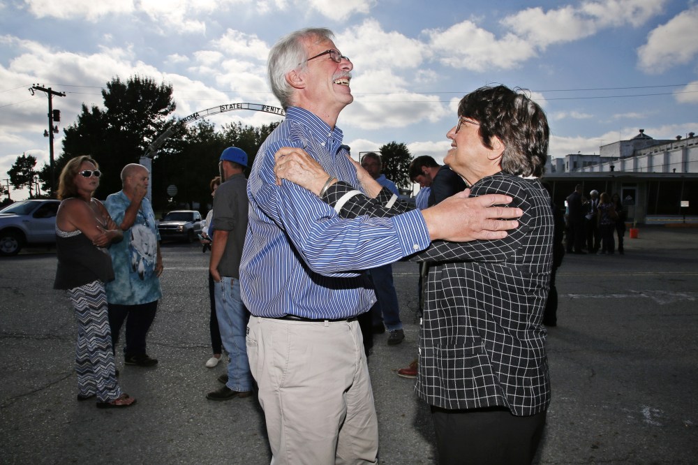 Death penalty opponent Sister Helen Prejean celebrates with a friend of death row inmate Richard Glossip after his scheduled execution was postponed outside the Oklahoma State Penitentiary in McAlester, Okla., Sept. 30, 2015. (Photo by Sue Ogrocki/AP)