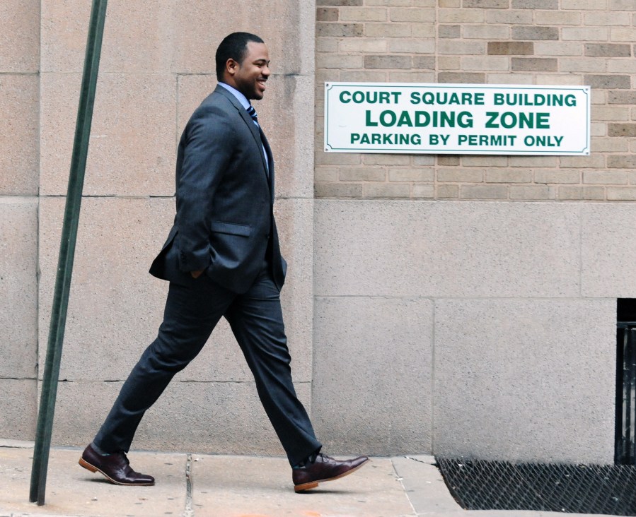 Baltimore City police officer William Porter, one of six police officers charged, leaves Courthouse East after his trial has gone into juror deliberation, Dec. 14, 2015 in Baltimore. (Photo by Kenneth K. Lam/Baltimore Sun/AP)
