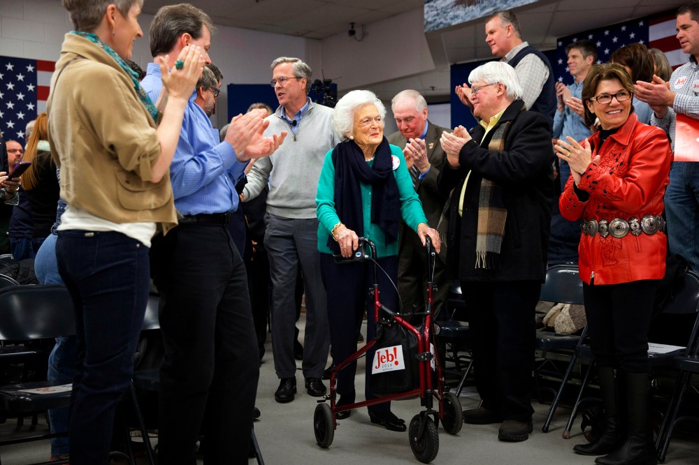 People stand and applaud as Republican presidential candidate and former Florida Gov. Jeb Bush arrives with his mother Barbara Bush to a town hall meeting in Derry, N.H., Feb. 4, 2016. (Photo by Jacquelyn Martin/AP)