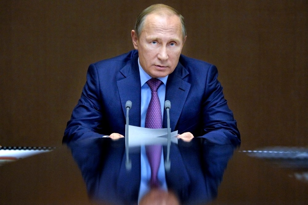 In this file photo, Russian President Vladimir Putin chairs a meeting with defense officials in the Black Sea resort of Sochi, Russia. (Photo by Alexei Druzhinin/Sputnik/Kremlin/Pool/AP)