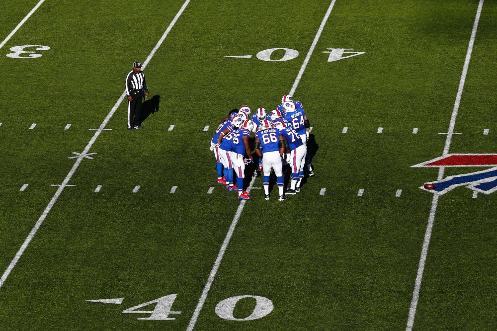 The Buffalo Bills huddle during an NFL football game against the Miami Dolphins at Ralph Wilson Stadium on Sunday, Nov. 8, 2015 in Orchard Park, N.Y. (Photo by Aaron M. Sprecher/AP)