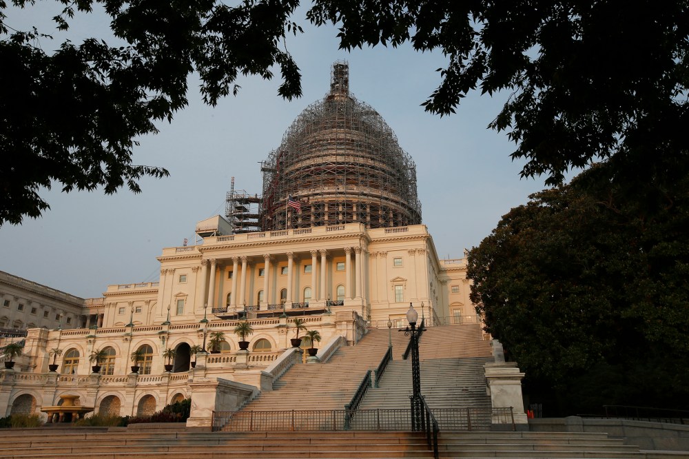 The west front of the U.S. Capitol is seen under repair Sept. 2, 2015 in Washington. (Photo by Alex Brandon/AP)