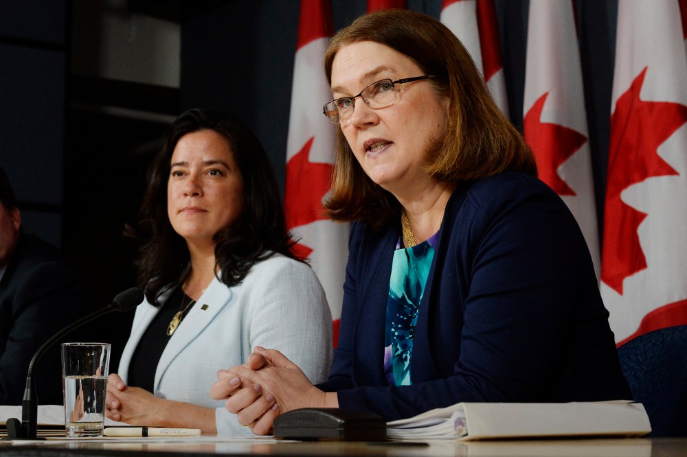 Canada's Health Minister Jane Philpott, right, speaks as Justice Minister Jody Wilson-Raybould listens at a news conference in Ottawa on April 14, 2016. (Photo by Adrian Wyld/The Canadian Press/AP)