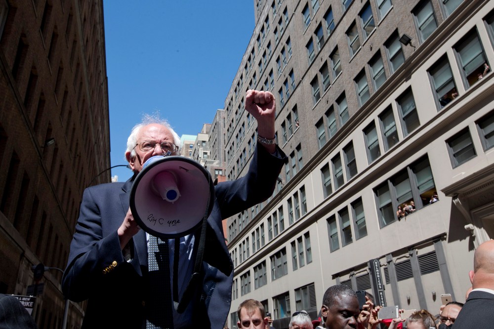 Democratic presidential candidate Sen. Bernie Sanders, I-Vt. speaks to Communication Workers of America (CWA) picketers in midtown Manhattan, N.Y., April 18, 2016. (Photo by Mary Altaffer/AP)