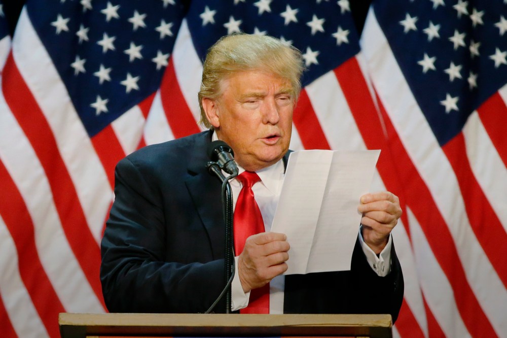 Republican presidential candidate Donald Trump looks at a sheet of notes and talking points as he speaks during a rally in Eugene, Ore., May 6, 2016. (Photo by Ted S. Warren/AP)