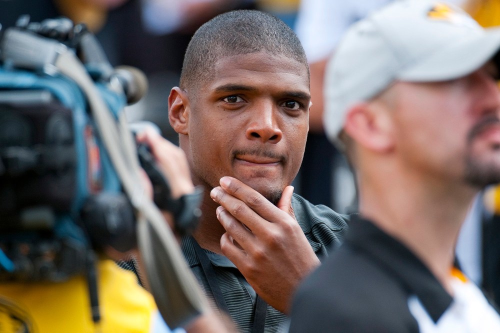 Former Missouri player Michael Sam watches pregame festivities before the start of the South Dakota State-Missouri NCAA college football game Saturday, Aug. 30, 2014, in Columbia, Mo.