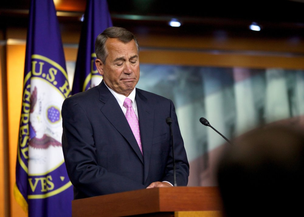 House Speaker John Boehner of Ohio listens to a reporter's question during a news conference on Capitol Hill in Washington, D.C., November 14, 2013.