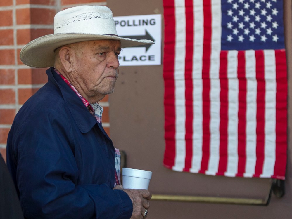 Jose Castrejon Olivares lines up to vote early Tuesday, Nov. 6, 2012 in Los Angeles. (Photo by AP Photo/Damian Dovarganes)