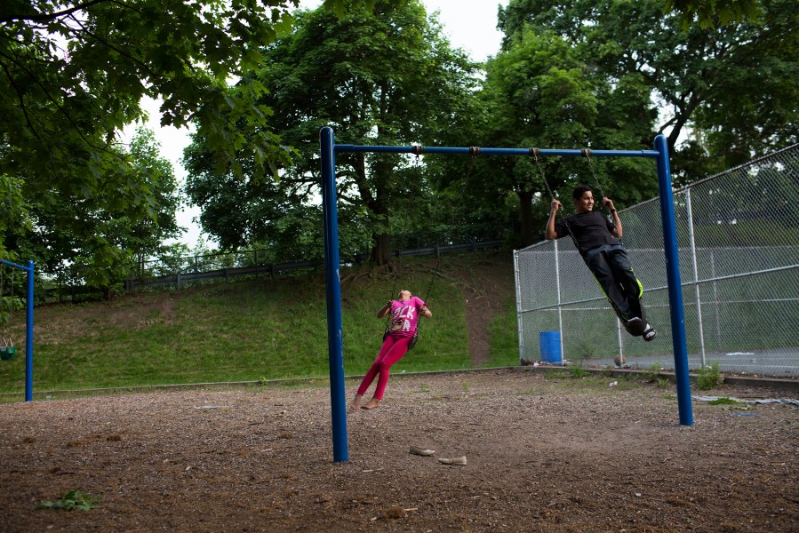 Youths play at a park along High Street on Memoiral Day in Central Falls.