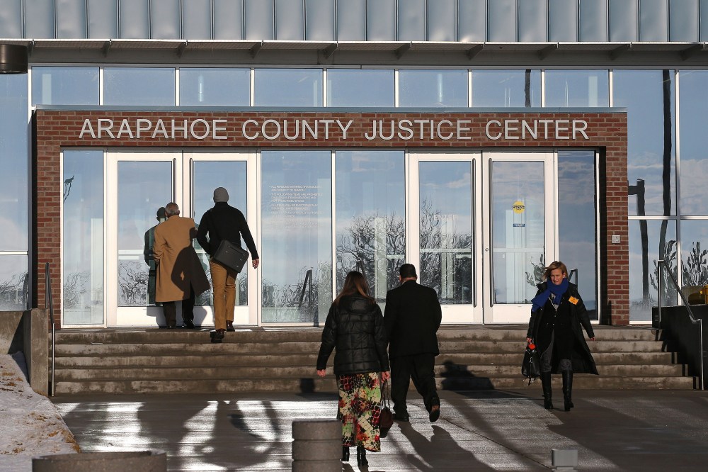 People enter the Arapahoe County Justice Center in Centennial, Colo., on Jan. 20, 2015. (Photo by Brennan Linsley/AP)