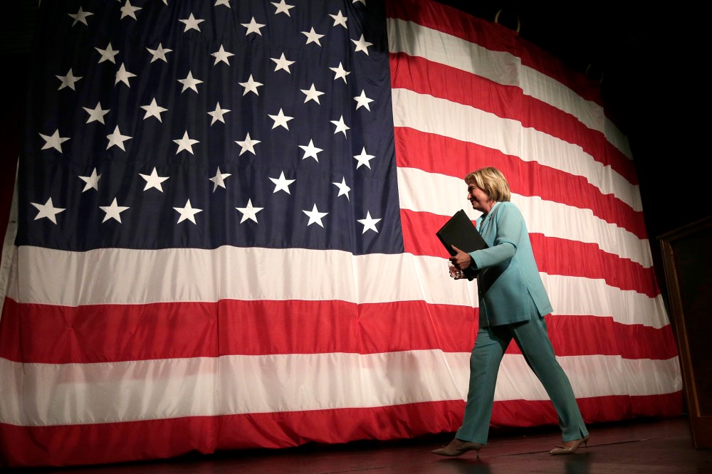 Democratic presidential candidate Hillary Rodham Clinton walks off the stage after speaking at the at the Iowa Democratic Wing Ding at the Surf Ballroom, Aug. 14, 2015, in Clear Lake, Iowa. (Photo by Charlie Riedel/AP)