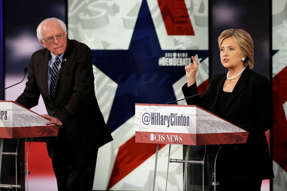 Hillary Rodham Clinton, right, makes a point as Bernie Sanders listens during a Democratic presidential primary debate, Nov. 14, 2015, in Des Moines, Iowa. (Photo by Charlie Neibergall/AP)