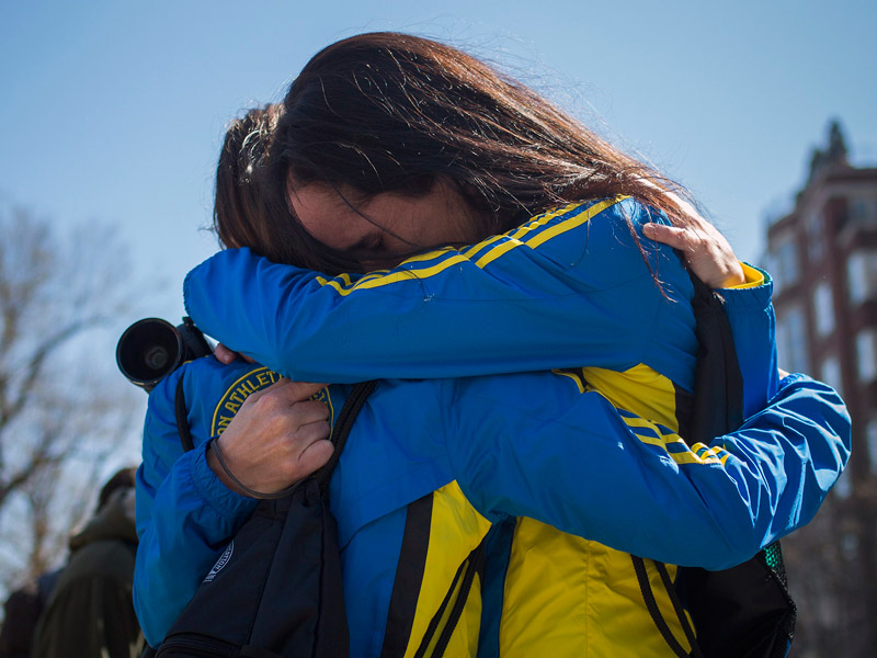 Boston Marathon runners Lisa Kresky-Griffin and Tammy Snyder embrace at the barricaded entrance at Boylston Street near the finish line of the Boston Marathon in Boston, Massachusetts on April 16, 2013. (Photo by Shannon Stapleton/Reuters)