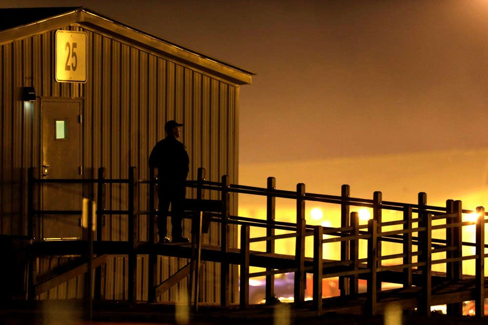 Security personnel stands outside the Eastern Reception, Diagnostic & Correctional Center in in Bonne Terre, Mo., before an execution on Nov. 19, 2013.