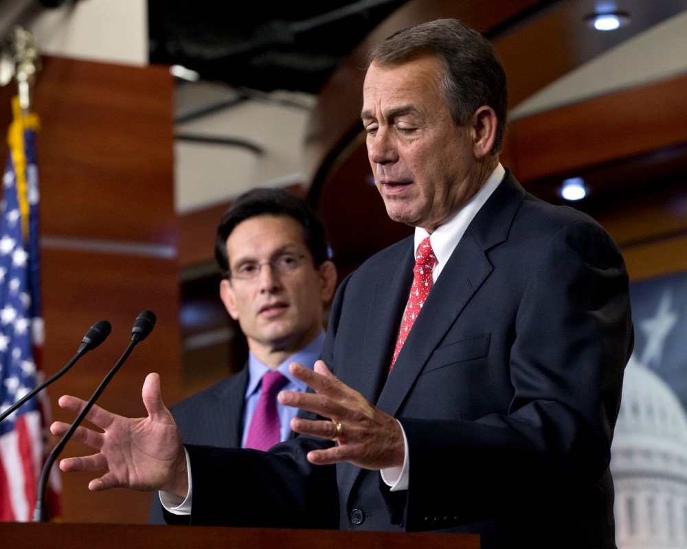 Speaker of the House John Boehner, R-Ohio, joined by House Majority Leader Eric Cantor, R-Va., left, speaks to reporters about the fiscal cliff negotiations at the Capitol in Washington, Friday, Dec. 21, 2012. (Photo by J. Scott Applewhite/AP Photo)