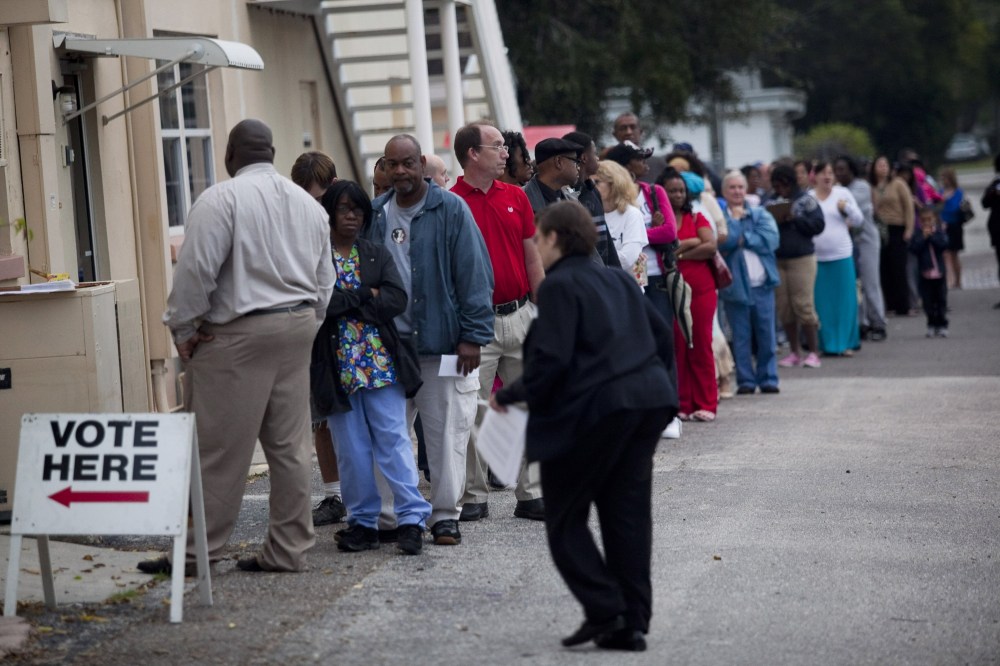 Lines of voters wait to cast their ballots as the polls open on Nov. 6 in St. Petersburg, Florida. (Photo: Edward Linsmier/Getty Images)
