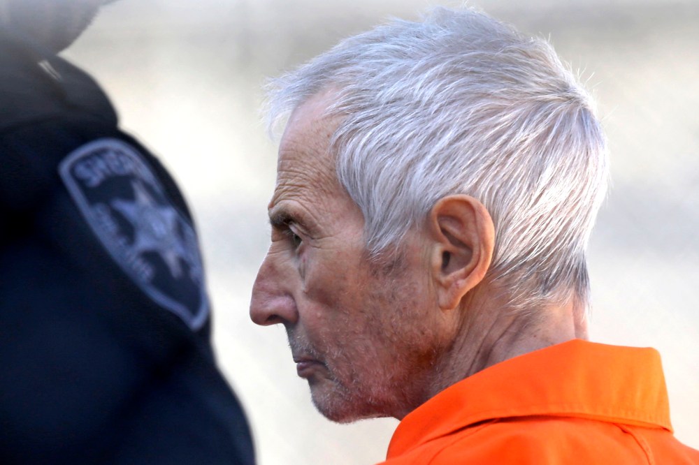 Robert Durst is escorted into Orleans Parish Prison after his arraignment in Orleans Parish Criminal District Court in New Orleans, on March 17, 2015.