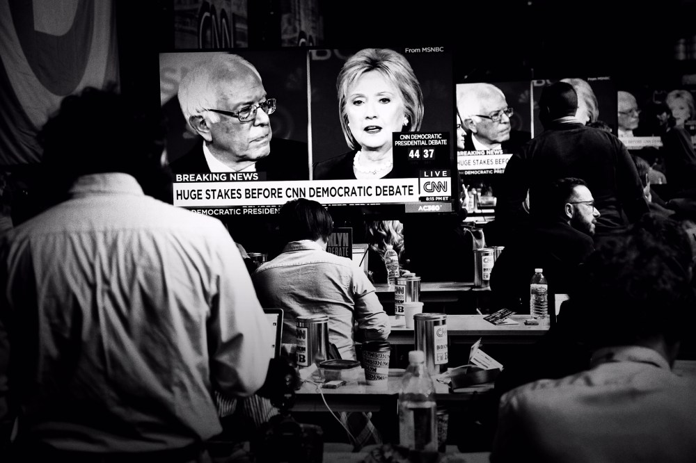 Bernie Sanders and Hillary Clinton are seen sparring on televisions in the reporters' filing room at the CNN Debate in Brooklyn, N.Y., April 14, 2016. (Photo by Mark Peterson/Redux for MSNBC)