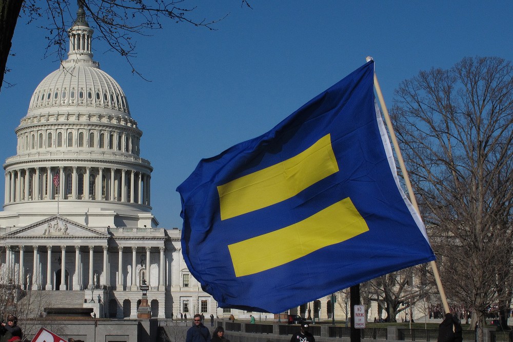 File photo: signs and line the sidewalks in front of the Capitol Building and the Supreme Court in Washington D.C. on Tuesday, March 26, 2013. (Photo by: Alex Menendez/AP Photo)