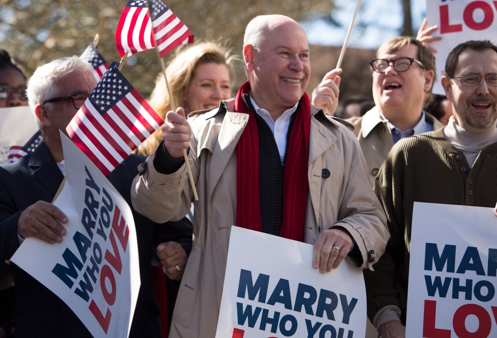 Robert Roman and Claus Ihlemann of Virginia Beach celebrate with Carol Schall, Mary Townley , Tim Bostic and Tony London, Thursday's ruling that Virginia's same-sex marriage ban was unconstitutional.