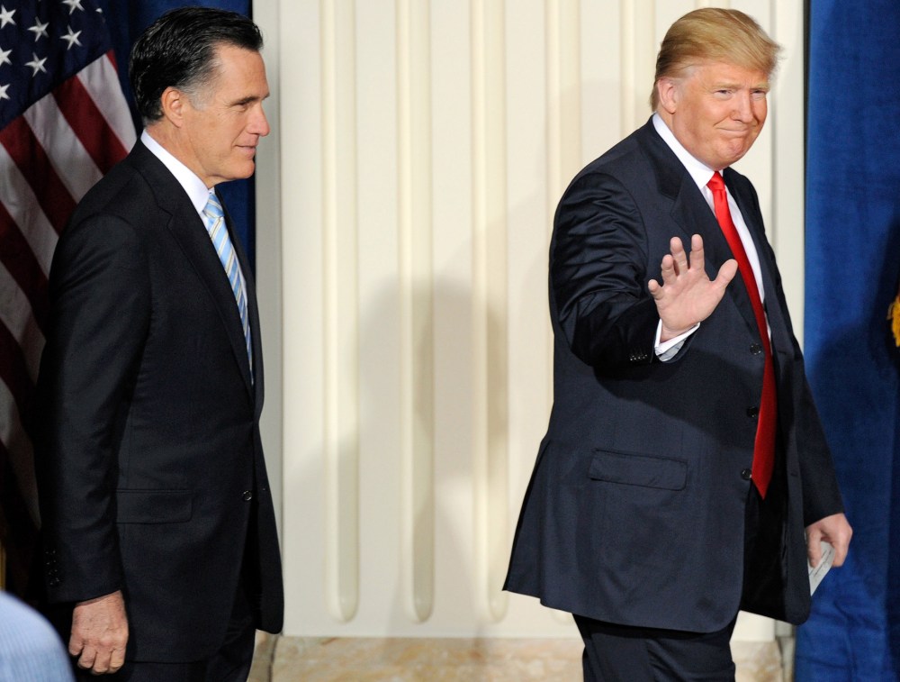 Then-Republican presidential candidate Mitt Romney and Donald Trump arrive at a news conference held by Trump to endorse Romney for president at the Trump International Hotel & Tower Las Vegas, Feb. 2, 2012. (Photo by Ethan Miller/Getty)