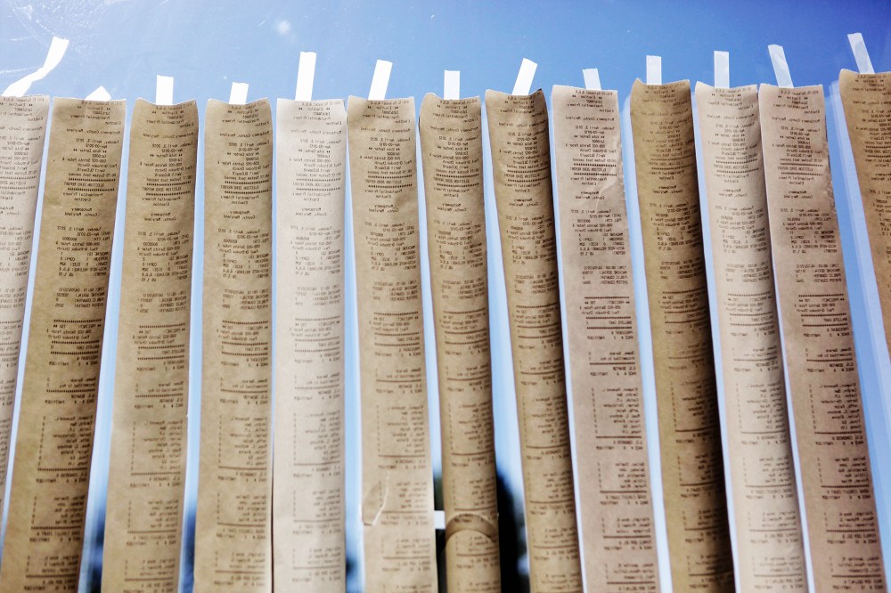 Sample ballots from digital voting machines are taped to a window during the presidential primary election on April 3, 2012 in Potomac, Maryland. (Photo by Chip Somodevilla/Getty)