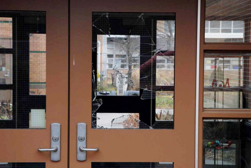 This handout crime scene evidence photo provided by the Connecticut State Police shows a damaged door of the Sandy Hook Elementary School following the Dec. 14, 2012 shooting rampage. (Photo by Connecticut State Police/Getty)