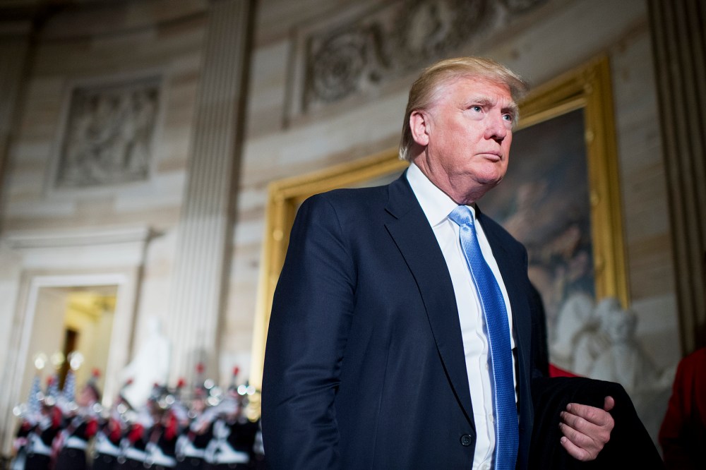 Donald Trump leaves a Congressional Gold Medal in the Capitol's rotunda on March 24, 2015. (Photo by Tom Williams/CQ Roll Call/Getty)