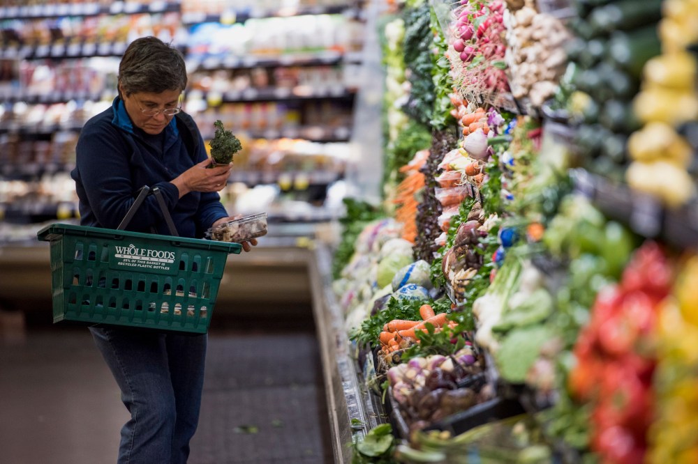 A customer shops for produce at a Whole Foods Market Inc. store in Oakland, Calif. on May 6, 2015.