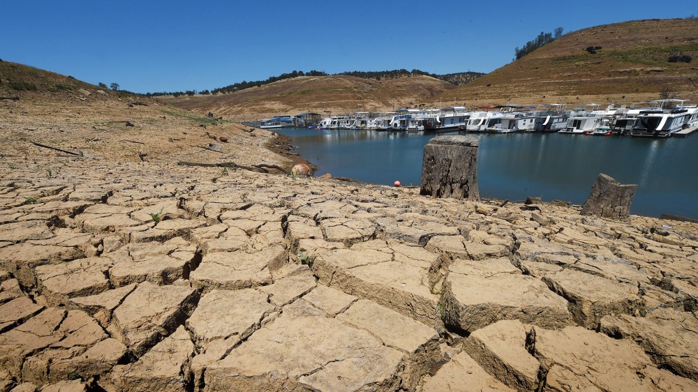 Dried mud and the remnants of a marina is seen at the New Melones Lake reservoir which is now at less than 20 percent capacity as a severe drought continues to affect California on May 24, 2015. (Photo by Mark Ralston/AFP/Getty)