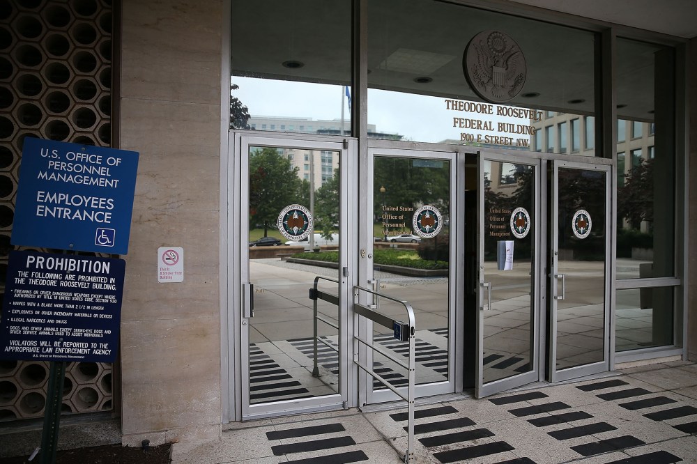 The entrance to the Theodore Roosevelt Federal Building that houses the Office of Personnel Management headquarters is shown June 5, 2015 in Washington, D.C. (Photo by Mark Wilson/Getty)