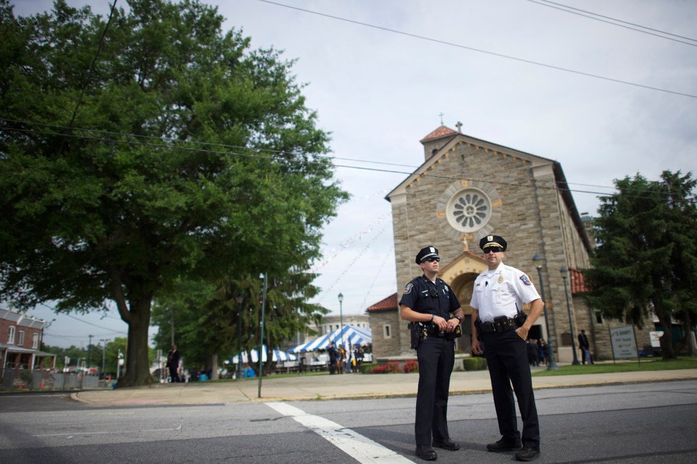 Police officers monitor activity outside St. Anthony of Padua Church before the burial is held for former Delaware Attorney General Beau Biden on June 6, 2015 in Wilmington, Del. (Photo by Mark Makela/Getty)
