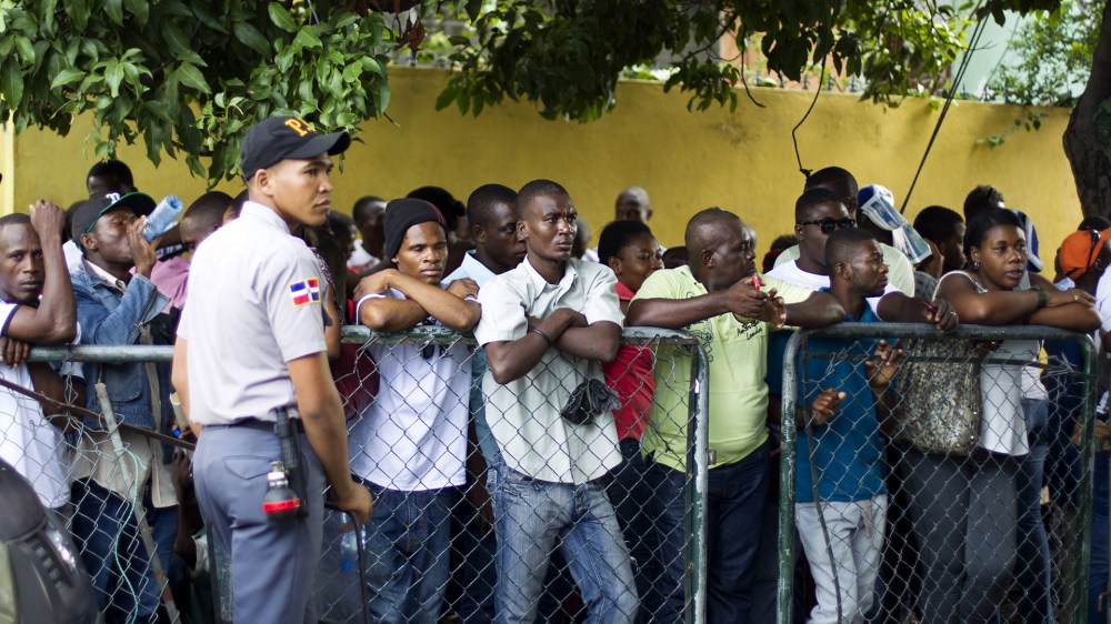 Haitians queue up to legalize their status at the Interior Ministry in Santo Domingo, on June 16, 2015. (Photo by Erika Santelices/AFP/Getty)