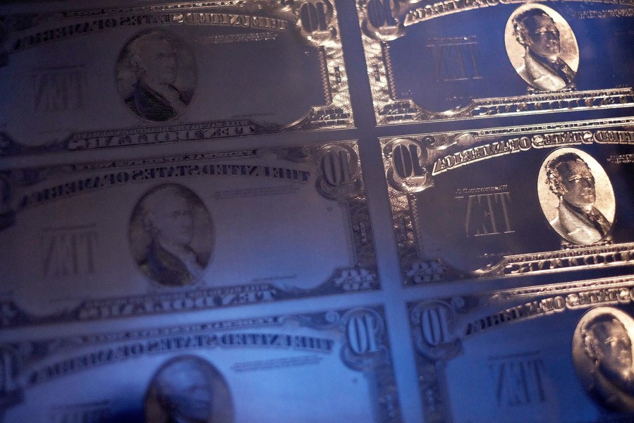 A display of $10 note currency plates from the past century are seen at a press conference at the National Archives on June 18, 2015 in Washington, DC. (Photo by T.J. Kirkpatrick/Getty)