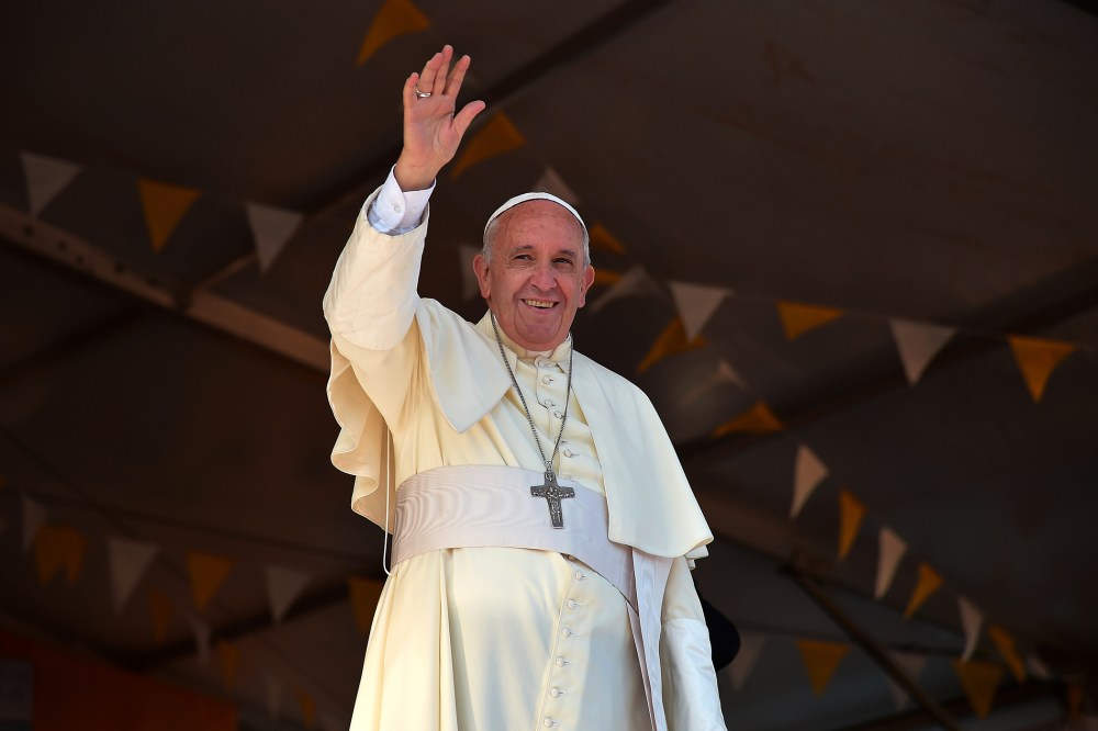 Pope Francis waves during a visit to the people of Banado Norte at the Chapel of Juan Bautista in Asuncion on July 12, 2015 (Photo by Vincenzo Pinto/AFP/Getty).