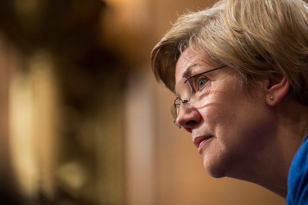 Senator Elizabeth Warren listens to Janet Yellen, chair of the U.S. Federal Reserve, during her semiannual report on the economy to the Senate Banking Committee in Washington, D.C., July 16, 2015. (Photo by Drew Angerer/Bloomberg/Getty)