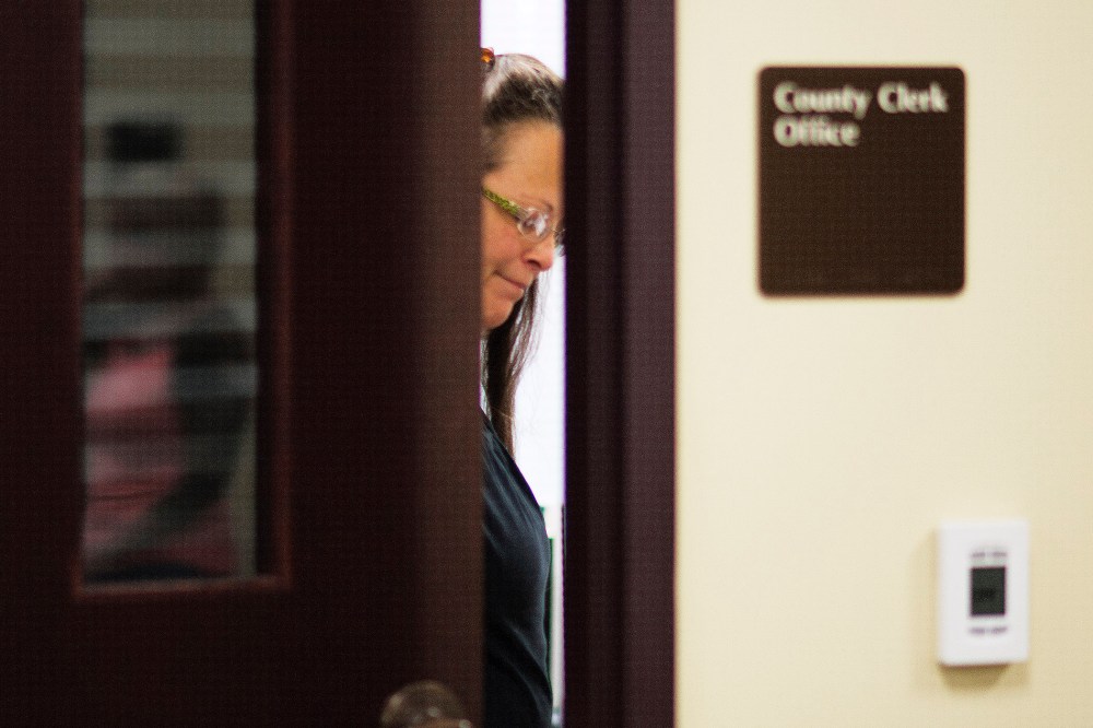 Kim Davis, the Rowan County Clerk of Courts, closes the door to her office after denying a marriage license at the County Clerks Office on September 2, 2015 in Morehead, Kentucky. (Photo by Ty Wright/Getty)
