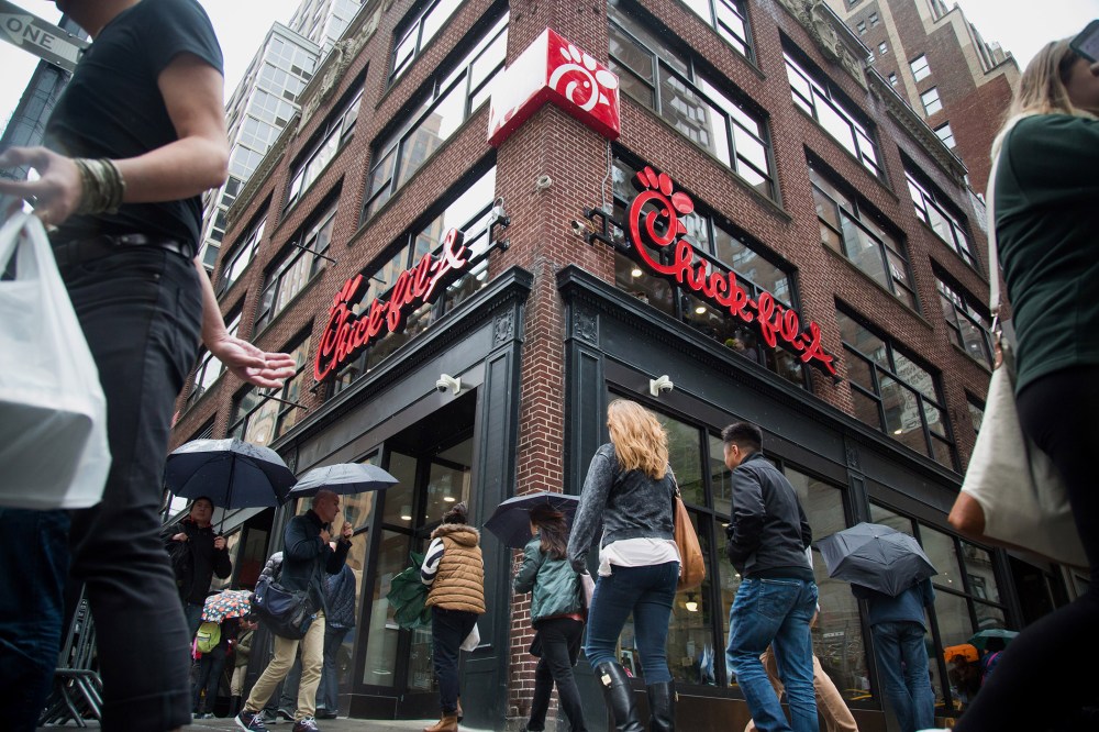 Pedestrians walk past a Chick-fil-A restaurant in New York, N.Y., on Oct. 2, 2015. (Photo by Michael Nagle/Bloomberg/Getty)