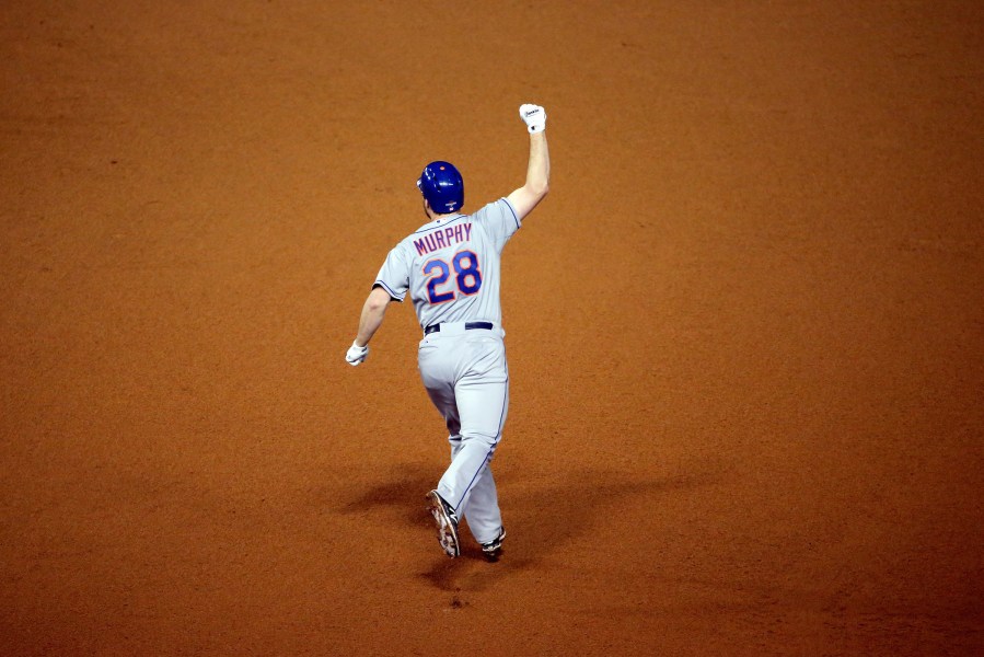 Daniel Murphy #28 of the New York Mets rounds the bases after hitting a two run home run in the eighth inning against Fernando Rodney #57 of the Chicago Cubs during game four of the 2015 MLB National League Championship Series at Wrigley Field on Oct. 21,