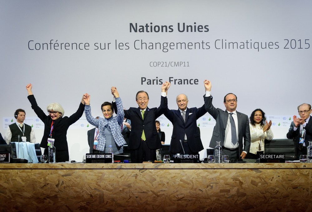 Executive Secretary of the UNFCCC Christiana Figueres, UN Secretary General Ban Ki Moon, President-designate of COP21 Laurent Fabius, and France's President Francois Hollande, Dec. 12, 2015. (Photo by Arnaud BOUISSOU/COP21/Anadolu Agency/Getty)