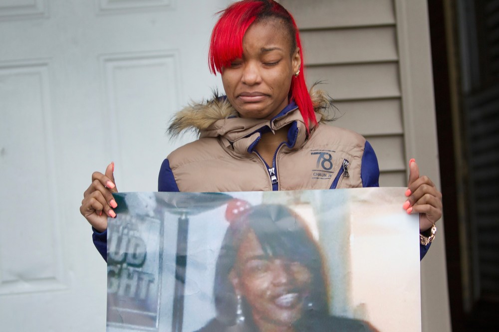 LaTonya Jones, the daughter of Bettie Jones, holds a picture of her mother during a vigil outside her home on Dec. 27, 2015 in Chicago, Ill. (Photo by Scott Olson/Getty)