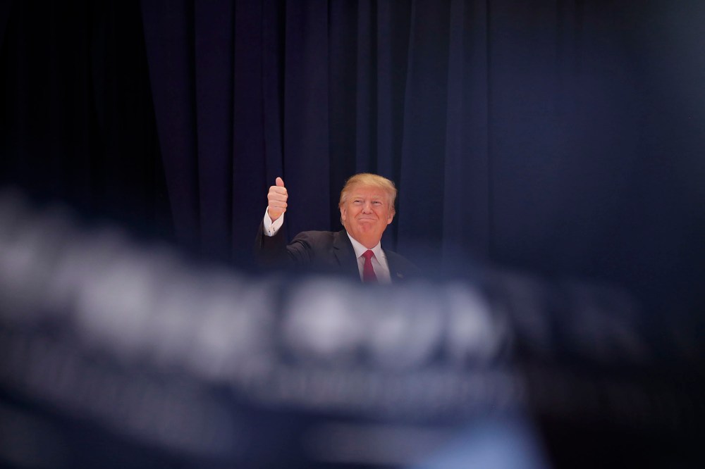 Republican presidential candidate Donald Trump gives a thumbs-up as he is introduced during a campaign event Jan. 23, 2016 in Pella, Ia. (Photo by Joshua Lott/Getty)
