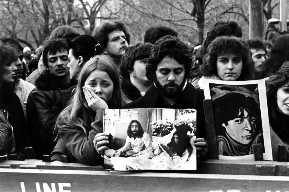 People line up to commemorate John Lennon in Central Park in New York after his death in 1980. (Photo by AGIP/RDA/Getty)