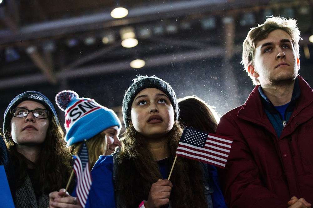 Audience members listen to Democratic presidential hopeful, Sen. Bernie Sanders (D-VT) speak at a campaign rally and concert on Feb. 8, 2016 in Durham, N.H. (Photo by Andrew Burton/Getty)