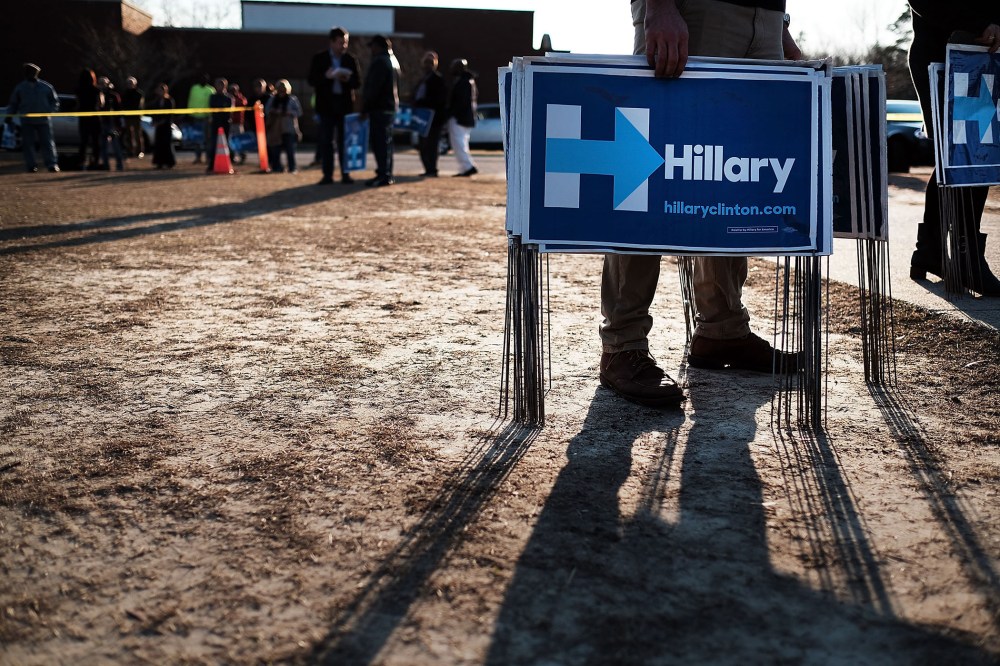 Campaign workers try to pass out signs following an appearance by Democratic presidential candidate Hillary Clinton on Feb. 12, 2016 in Denmark, S.C. (Photo by Spencer Platt/Getty)