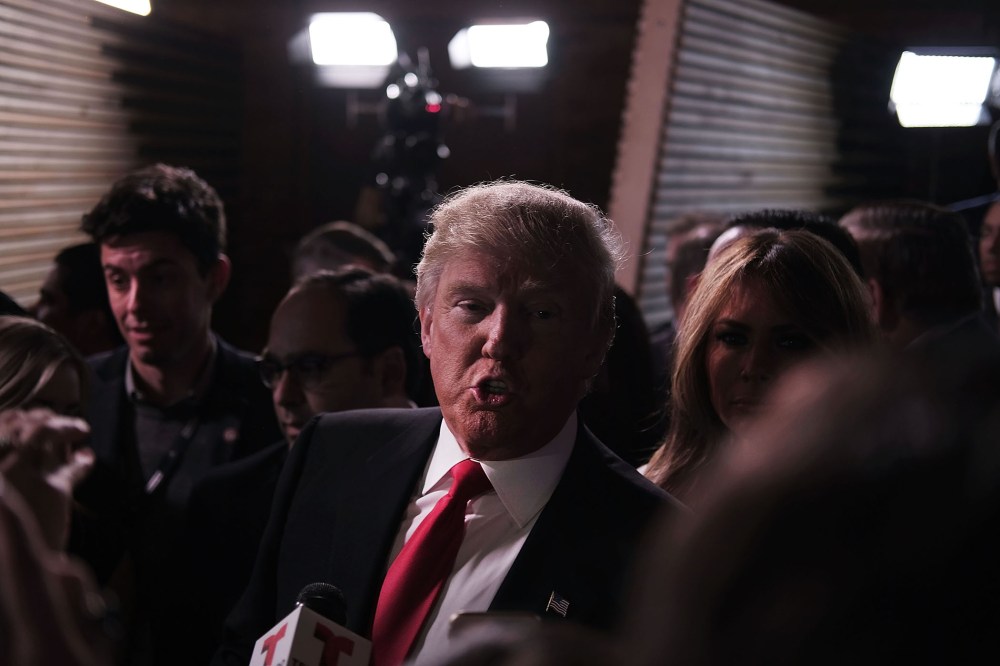 Presidential candidate Donald Trump speaks in the "Spin Room" following the Republican Presidential debate, Feb. 13, 2016 in Greenville, S.C. (Photo by Spencer Platt/Getty)