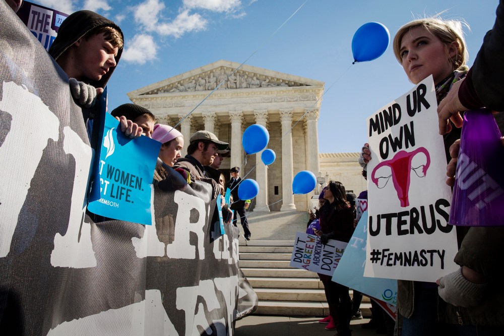 Pro-choice advocates and anti-abortion advocates rally outside of the Supreme Court, March 2, 2016 in Washington, DC. (Photo by Drew Angerer/Getty)