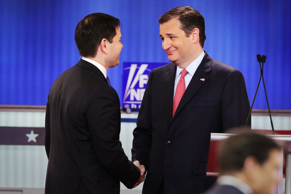 Republican presidential candidates Sen. Marco Rubio (R-FL) and Sen. Ted Cruz (R-TX) shake hands in a debate at the Fox Theatre on March 3, 2016 in Detroit, Mich. (Photo by Chip Somodevilla/Getty)