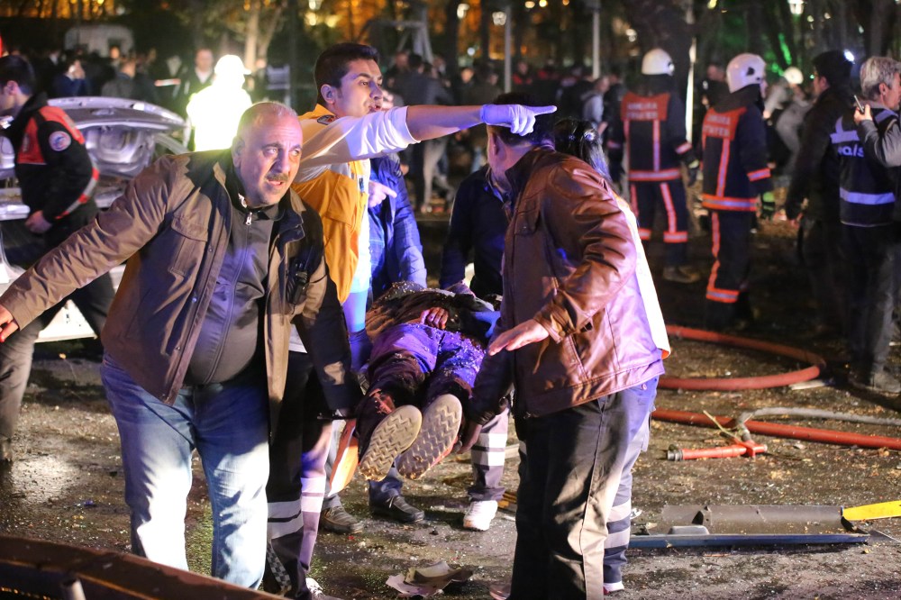 Rescuers carry a victim on a stretcher at the scene of a blast in Ankara on March 13, 2016. At least 27 people were killed and 75 others wounded in a blast in the heart of the Turkish capital Ankara. (Photo by Erol Ucem/AFP/Getty)